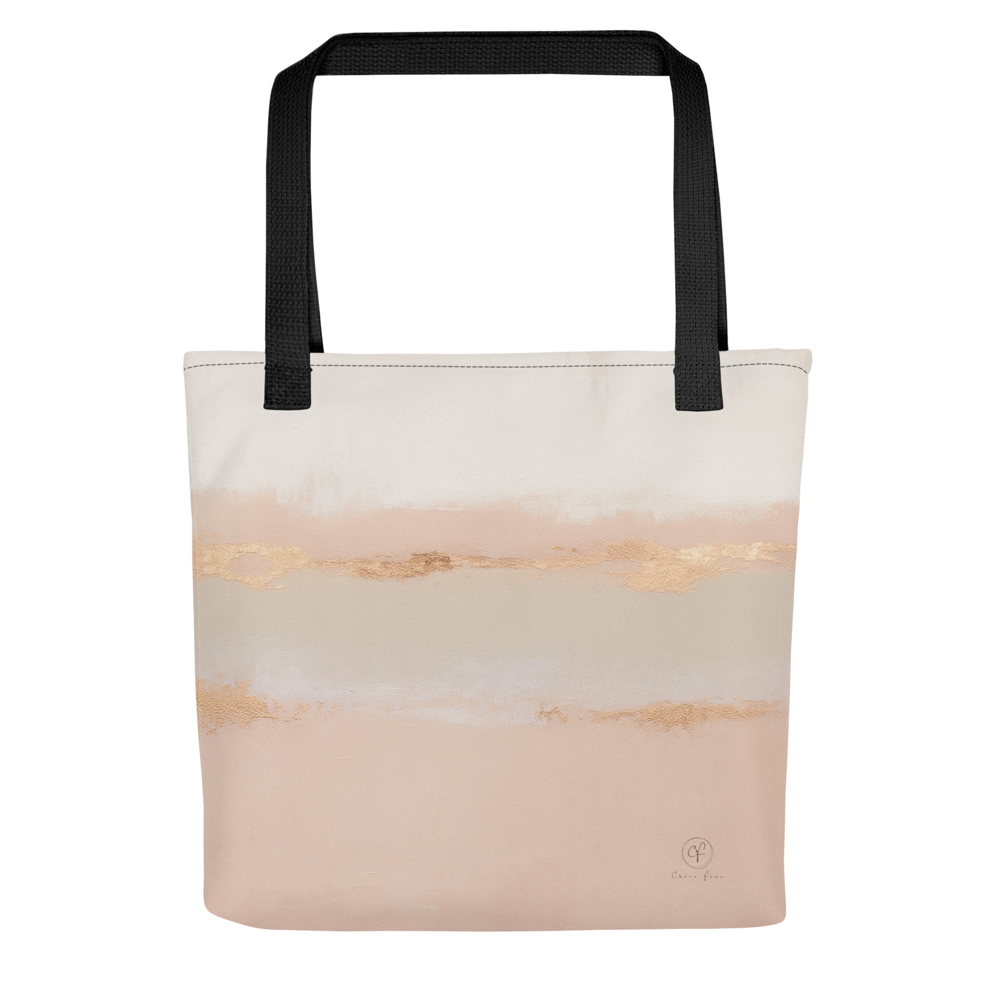 Beige and blush abstract tote bag with gold brushstroke accents and black handles on a white background.