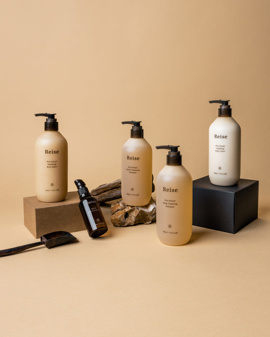 Set of Reise haircare products on a beige background