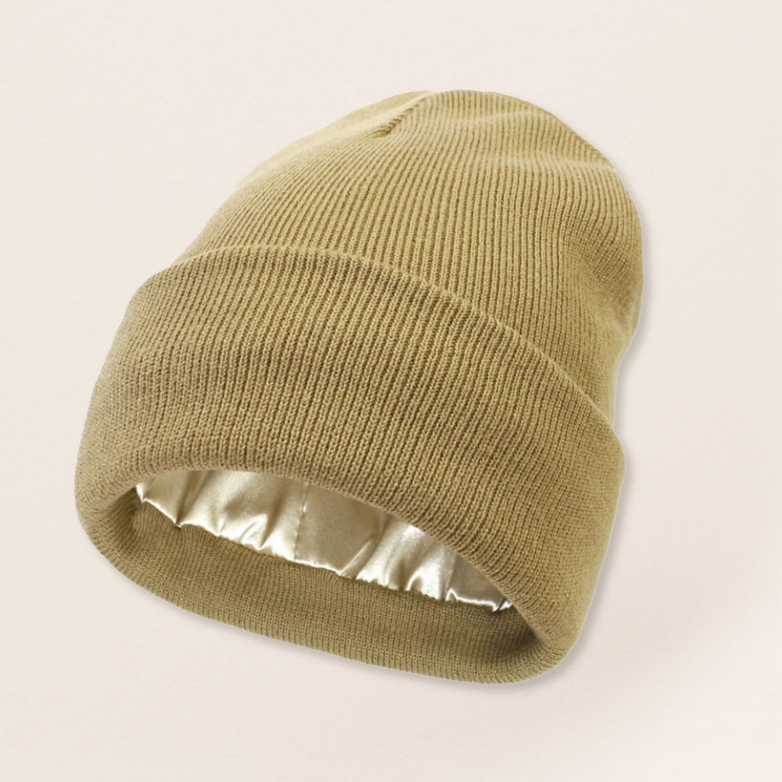 Beige beanie with satin interior on a beige background