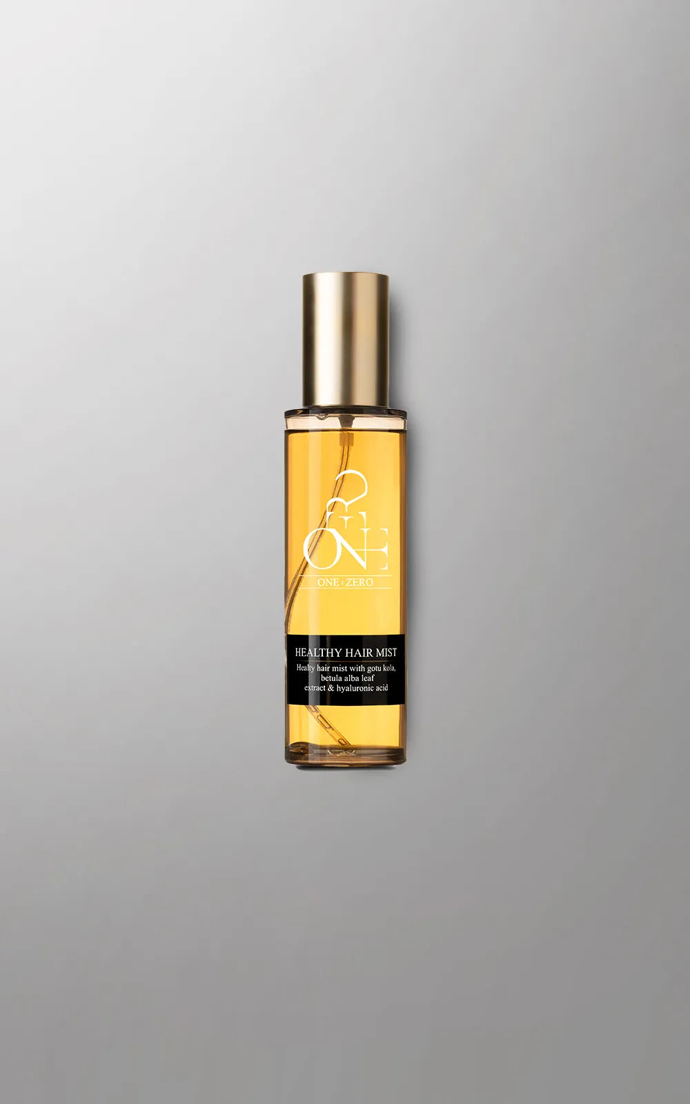 Bottle of hair oil with a gold cap for fine hair on a gray background