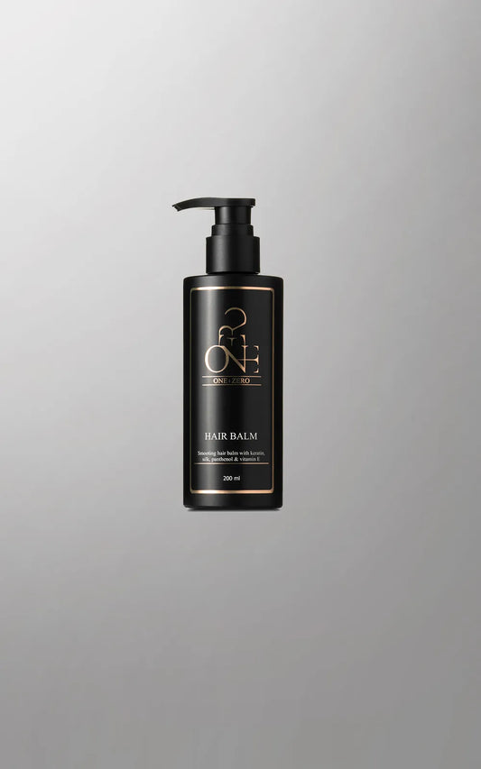 Black hair conditioner bottle with pump for fine hair on a gray background